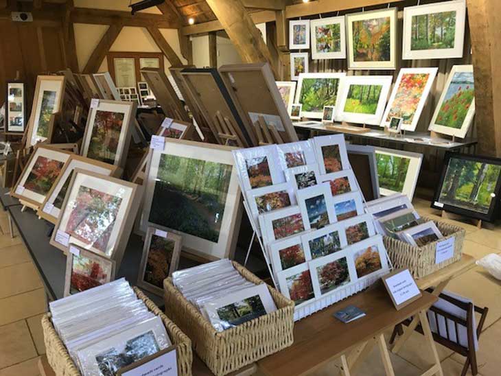 Collection of artist's prints displayed in the Great Oak Hall