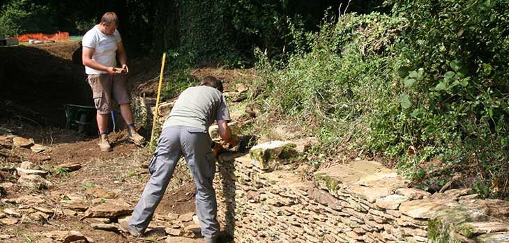 Volunteers helping with the restoration of the ha-ha near Mitchell Drive