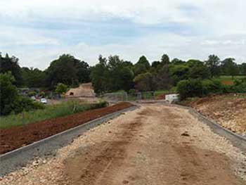 Staff access road, showing Plant Centre to left and the parking just above it