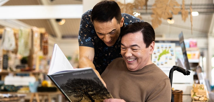 People looking at nature books in the Westonbirt Shop